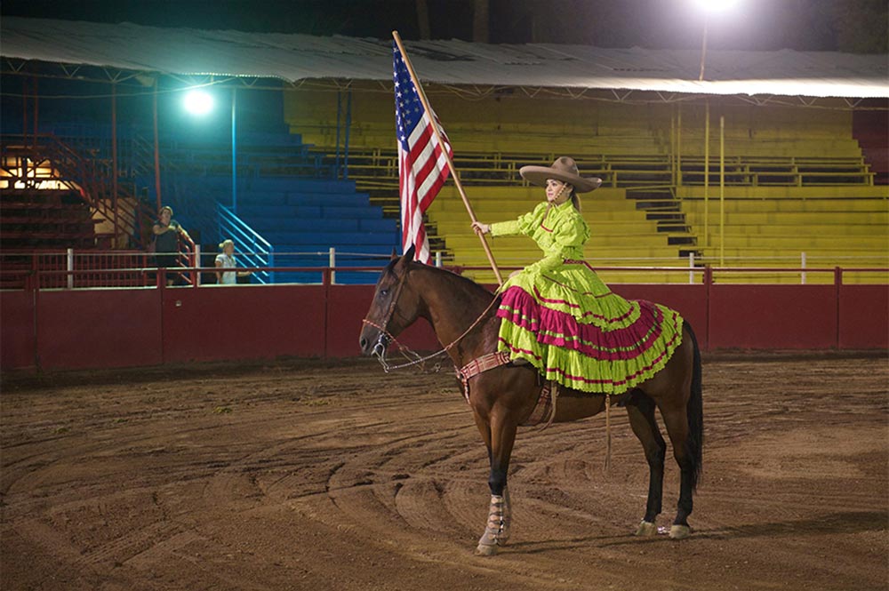 Corona Ranch Rodeo Girl On Horse With US Flag